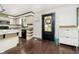 Galley kitchen with white cabinets, dark floors, and island at 1850 White Oak W Ln, Martinsville, IN 46151