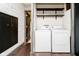 Laundry room with washer, dryer, and shelving at 1850 White Oak W Ln, Martinsville, IN 46151
