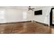 Spacious living room with hardwood floors and a ceiling fan at 1850 White Oak W Ln, Martinsville, IN 46151