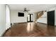 Living room with hardwood floors, shiplap, and access to deck at 1850 White Oak W Ln, Martinsville, IN 46151