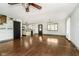 Bright living room with hardwood floors and kitchen view at 1850 White Oak W Ln, Martinsville, IN 46151
