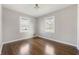 Well lit bedroom with hardwood floors and neutral walls at 2515 Rutgers Rd, Indianapolis, IN 46227