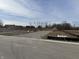 Empty lot with gravel driveway and mounds of dirt, ready for new construction at 2974 S Kings Way, New Palestine, IN 46163