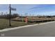 Empty lot with construction materials and a street sign at 2974 S Kings Way, New Palestine, IN 46163