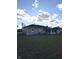 House exterior view, showcasing backyard and sunroom at 3118 26Th St, Columbus, IN 47203