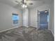 Spacious bedroom with ceiling fan and grey carpet at 424 S Oakland Ave, Indianapolis, IN 46201