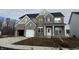 Two-story brick home with gray siding, white accents, and a two-car garage at 4958 Reavie Ct, Noblesville, IN 46062