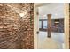 Basement with exposed brick wall and doorway at 6337 Cardinal Ln, Indianapolis, IN 46220