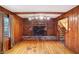 Spacious living room features hardwood floors, a brick fireplace, and built-in shelving at 6337 Cardinal Ln, Indianapolis, IN 46220