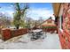 Brick patio with metal table and chairs, offering outdoor space at 6337 Cardinal Ln, Indianapolis, IN 46220