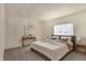 Main bedroom with a wooden bed frame and neutral decor at 636 Nuttal St, Westfield, IN 46074