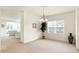 Spacious dining area with neutral decor and a view into the living room at 636 Nuttal St, Westfield, IN 46074