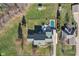 Aerial view of house and backyard, featuring a pool and detached structures at 6818 W Willow Grove Dr, New Palestine, IN 46163