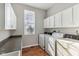 Bright laundry room with washer, dryer and countertop at 6818 W Willow Grove Dr, New Palestine, IN 46163