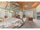 Main bedroom with canopy bed, sitting area, and fireplace at 6818 W Willow Grove Dr, New Palestine, IN 46163