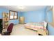 Light blue bedroom with built-in shelving and a bed at 6822 Bruton Dr, Indianapolis, IN 46256