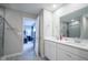 Modern bathroom with double vanity, walk-in shower, and view of bedroom at 8628 Kellner St, Pendleton, IN 46064