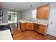 Modern kitchen with stainless steel appliances and wood cabinets at 105 Oakview Dr, Mooresville, IN 46158