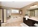 Spa-like bathroom featuring a large soaking tub and walk-in shower at 10566 Morningtide Cir, Fishers, IN 46038