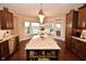 Island kitchen with granite countertops and breakfast nook at 10566 Morningtide Cir, Fishers, IN 46038