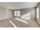 Bright bedroom with neutral walls, carpet, and two windows at 10808 Inspiration Dr, Indianapolis, IN 46259