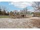 Large backyard with wood pile and shed at 12389 N Navajo Ct, Camby, IN 46113