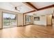 Large living room with sliding doors and wood beams at 12389 N Navajo Ct, Camby, IN 46113