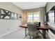 Bright home office features wood desk and large window overlooking backyard at 1486 Covington Blvd, Franklin, IN 46131