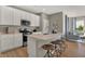 Modern kitchen with white cabinets, stainless steel appliances and an island at 1503 Covington Blvd, Franklin, IN 46131