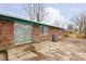 Brick home with sliding glass door leading to a patio at 1535 N Glen Arm Rd, Indianapolis, IN 46214