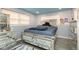 Bright bedroom with mirrored furniture and light blue walls at 1535 N Glen Arm Rd, Indianapolis, IN 46214
