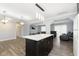 Open concept kitchen with island and breakfast bar at 1535 N Glen Arm Rd, Indianapolis, IN 46214