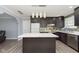 Modern kitchen with dark cabinets, quartz countertops and stainless steel appliances at 1535 N Glen Arm Rd, Indianapolis, IN 46214