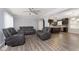 Open living room featuring hardwood floors and kitchen view at 1535 N Glen Arm Rd, Indianapolis, IN 46214