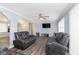 Spacious living room with hardwood floors and reclining sofas at 1535 N Glen Arm Rd, Indianapolis, IN 46214