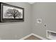 Simple laundry room with hookups and wall art at 1540 Ironwood Rd, Greenfield, IN 46140