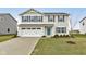 Two-story house with gray shutters, white garage door, and landscaped lawn at 1798 Cascades Dr, Greenfield, IN 46140