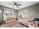 bedroom with twin bed, crib, and plenty of toys at 1937 Shiloh Dr, Columbus, IN 47203