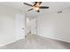 Well-lit bedroom with ceiling fan and access to hallway at 2221 N Moreland Ave, Indianapolis, IN 46222