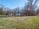 Aerial view of ranch house and detached garage on a large lot with mature trees at 2290 Wilbur Rd, Martinsville, IN 46151