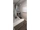 Bathroom with pedestal sink, tub, and shower at 2914 Collier St, Indianapolis, IN 46241