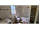 Updated bathroom with a large shower/tub combo and marble vanity at 2914 Collier St, Indianapolis, IN 46241