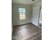 Charming bedroom with new flooring and fresh paint at 2914 Collier St, Indianapolis, IN 46241