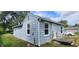 Rear view of the house showing its light blue siding and a ramp at 2914 Collier St, Indianapolis, IN 46241