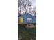 Front view of a blue house with yellow door at 2914 Collier St, Indianapolis, IN 46241
