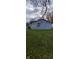 Rear view of a light blue house with a grassy yard at 2914 Collier St, Indianapolis, IN 46241