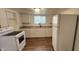 Cozy kitchen featuring white cabinets, granite countertops, and modern appliances at 2914 Collier St, Indianapolis, IN 46241
