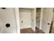 Convenient laundry area with shelving and hookups for a washer and dryer at 2914 Collier St, Indianapolis, IN 46241