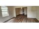 Bright living room with wood-look flooring and an open floor plan at 2914 Collier St, Indianapolis, IN 46241