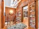 Upstairs hallway with log cabin walls and wood floors at 3499 Raspberry Ln, Nineveh, IN 46164